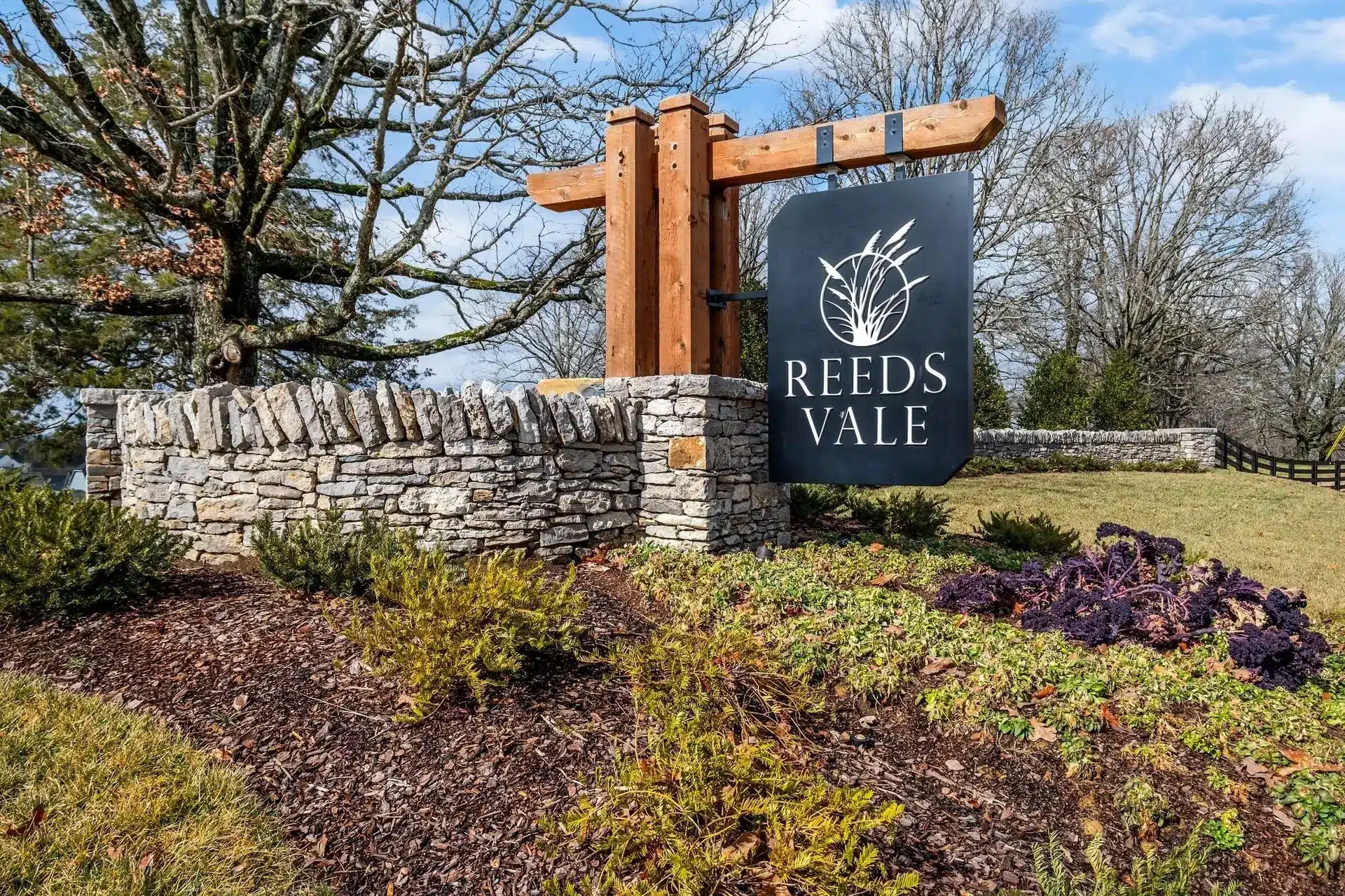 A welcome sign for Reeds Vale