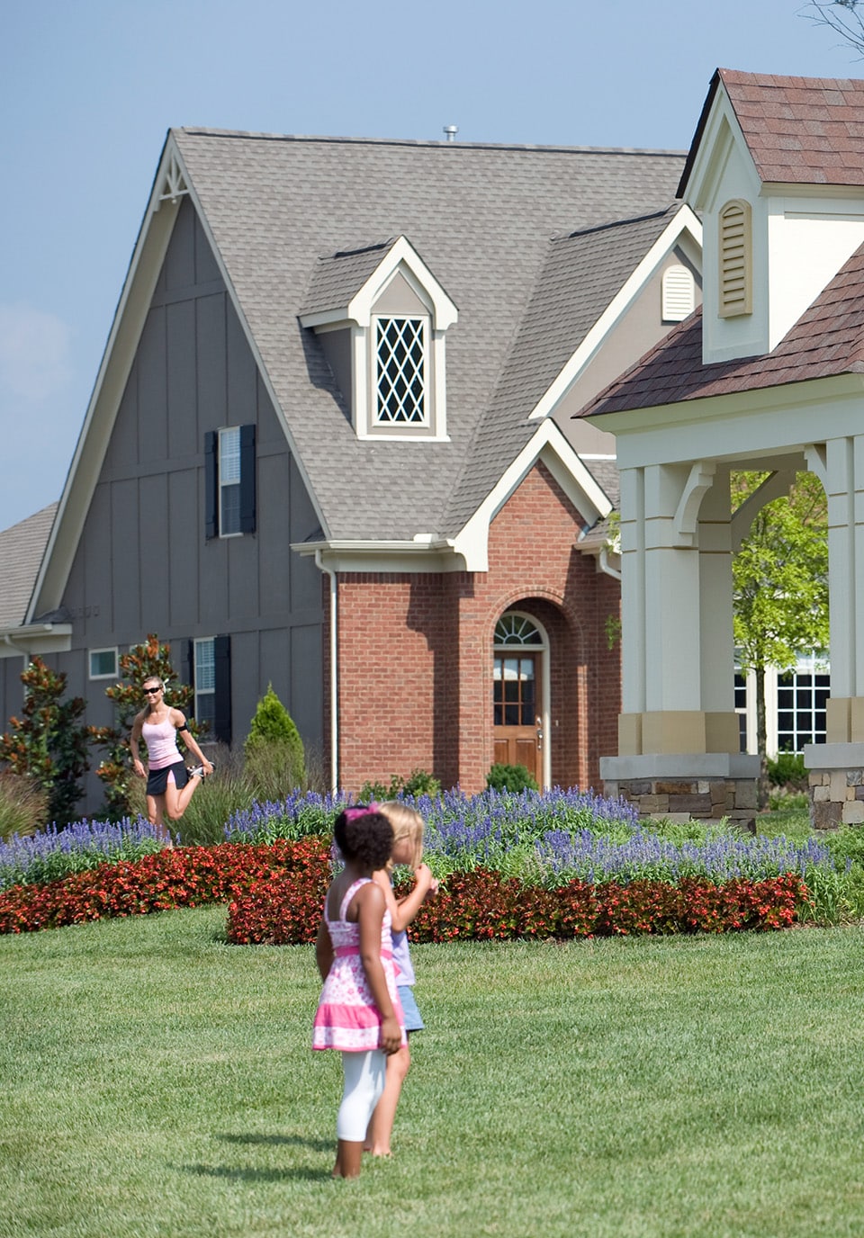 Two kids playing in a lawn